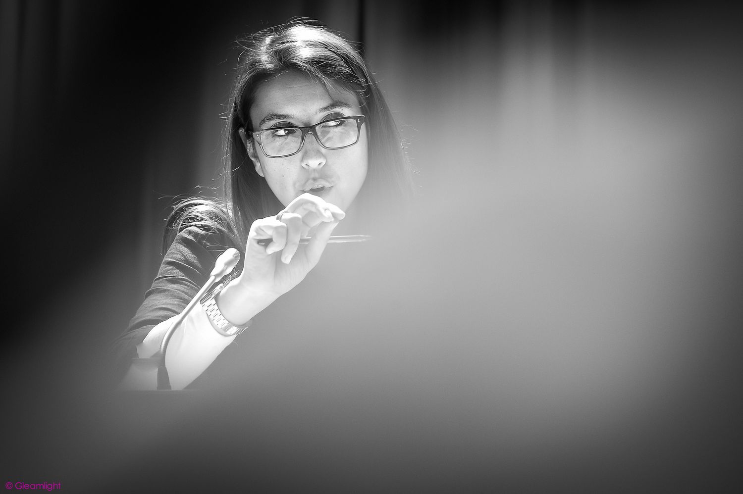 Black and white portrait shot of attendees at a professional conference.