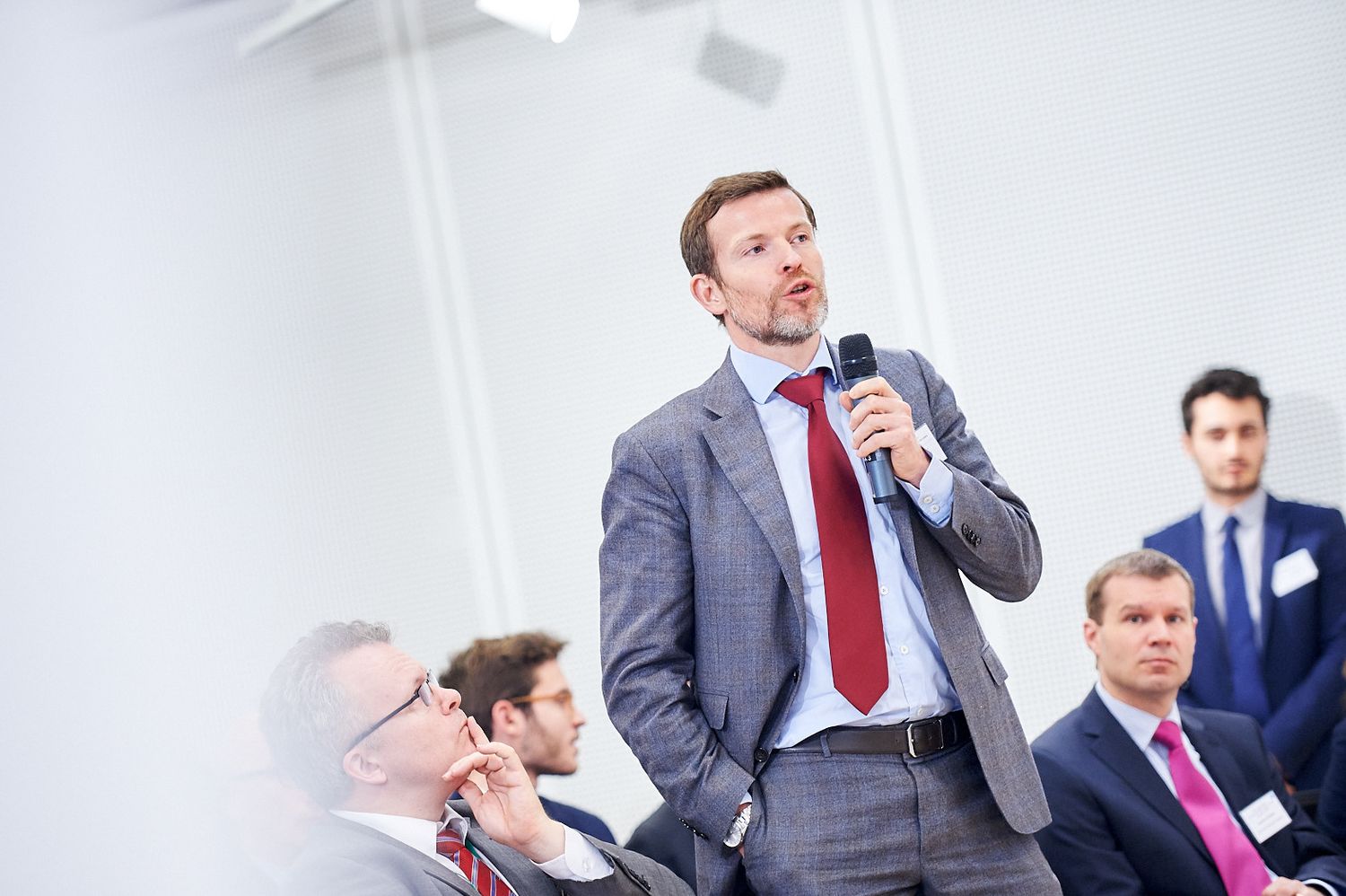 Business presentation in a modern conference room setting.