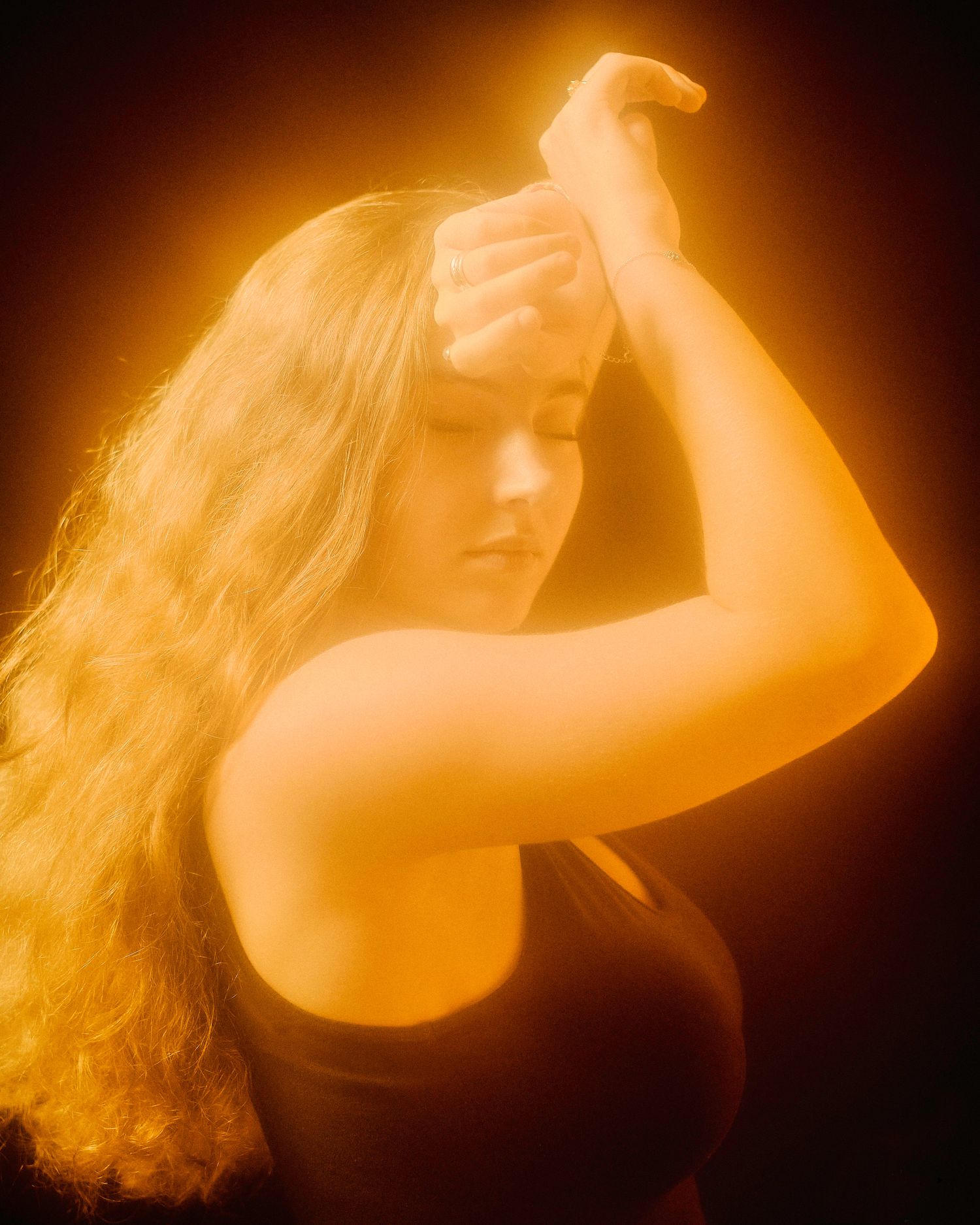 Ethereal golden-toned portrait sequence with flowing movement and warm backlighting.