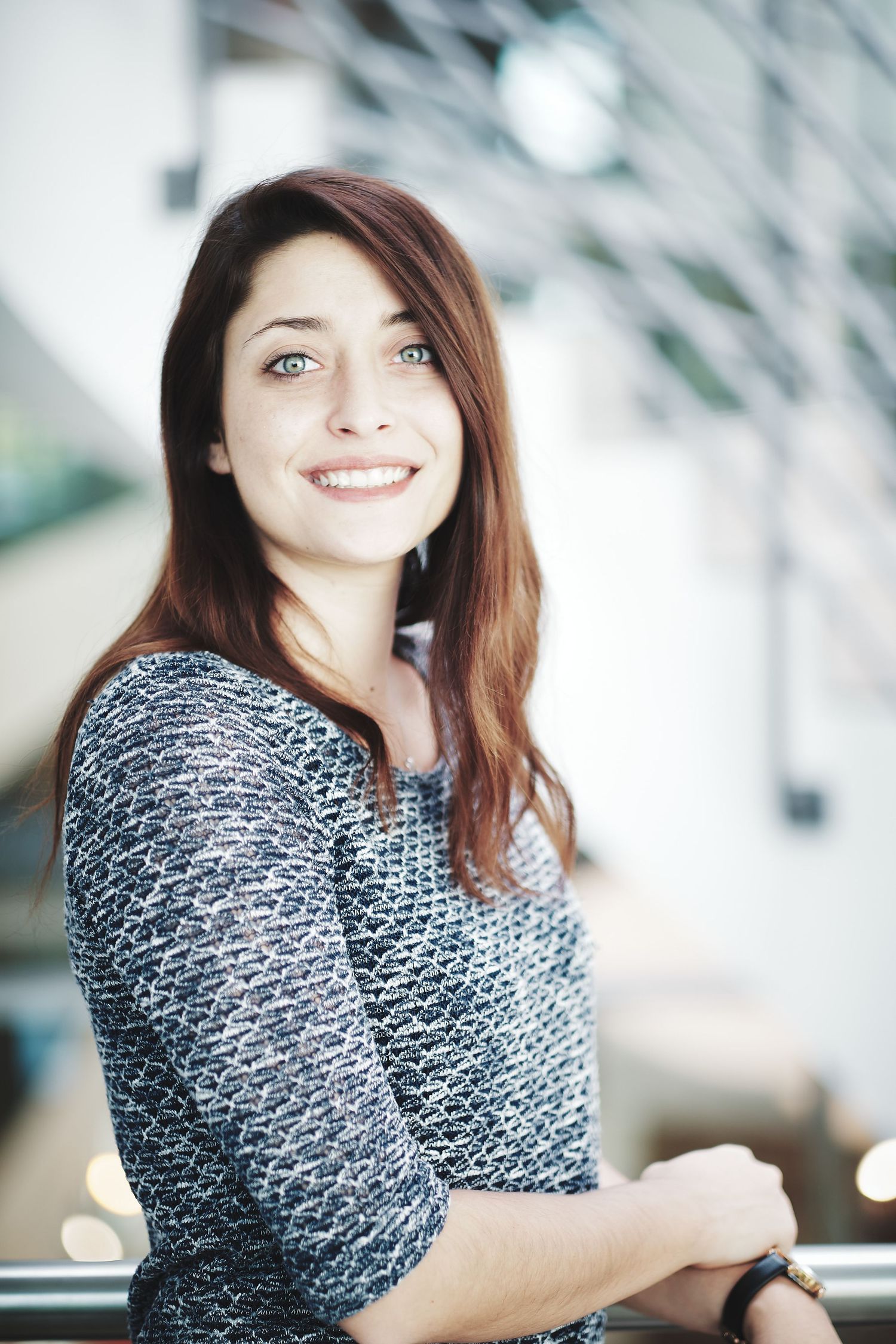Portrait series of person in textured sweater by window with natural lighting.