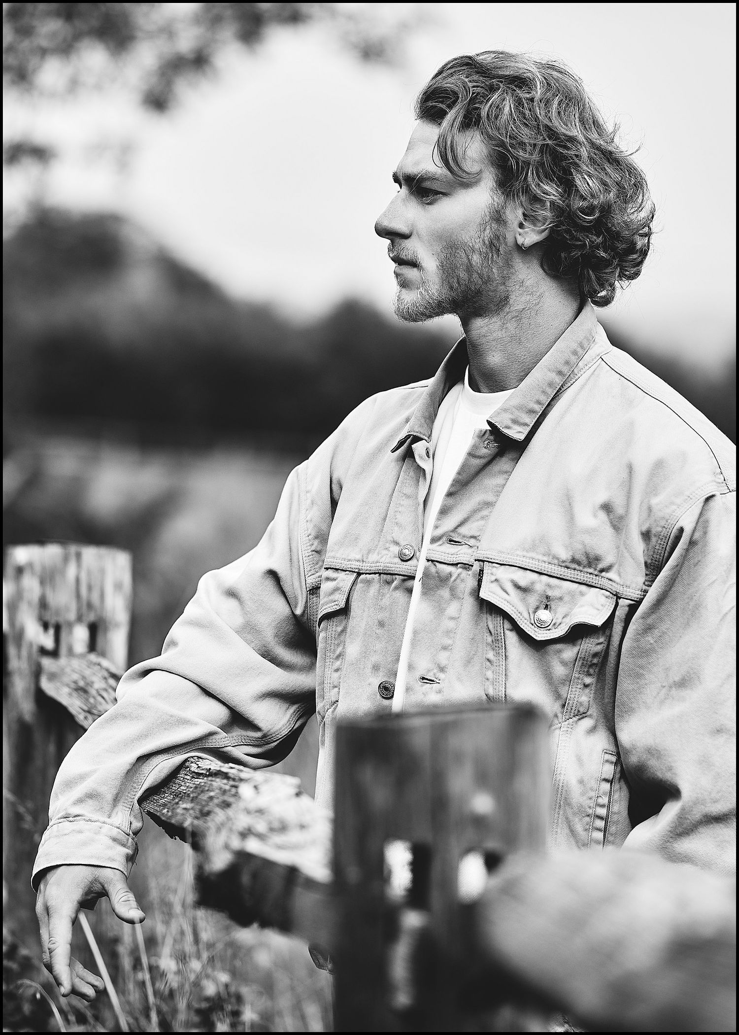 Outdoor portrait series in light denim jacket with soft natural lighting.