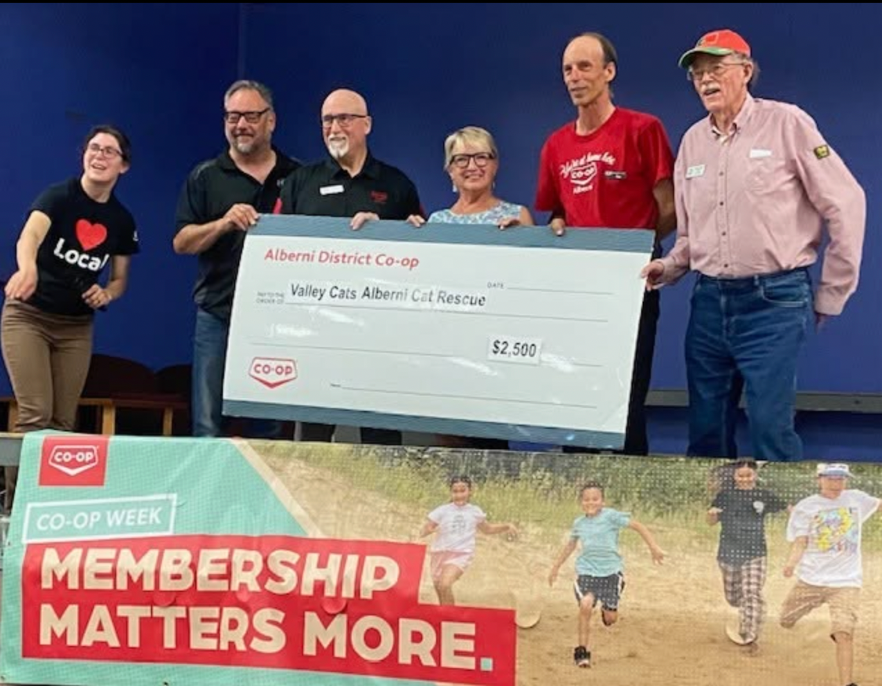 Alberni District Co-op members present a $2,500 cheque to Valley Cao Alberni Cat Festival during Co-op Week celebration.