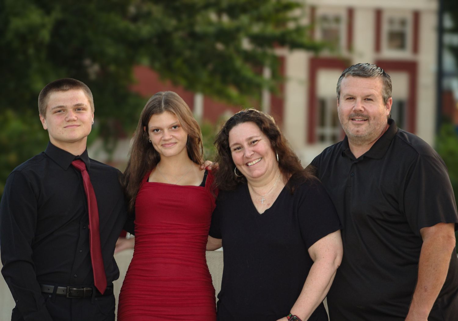 Homecoming family portrait captured by L&C Moments Photography in McDonough, GA - photography session featuring family smiles and moments.