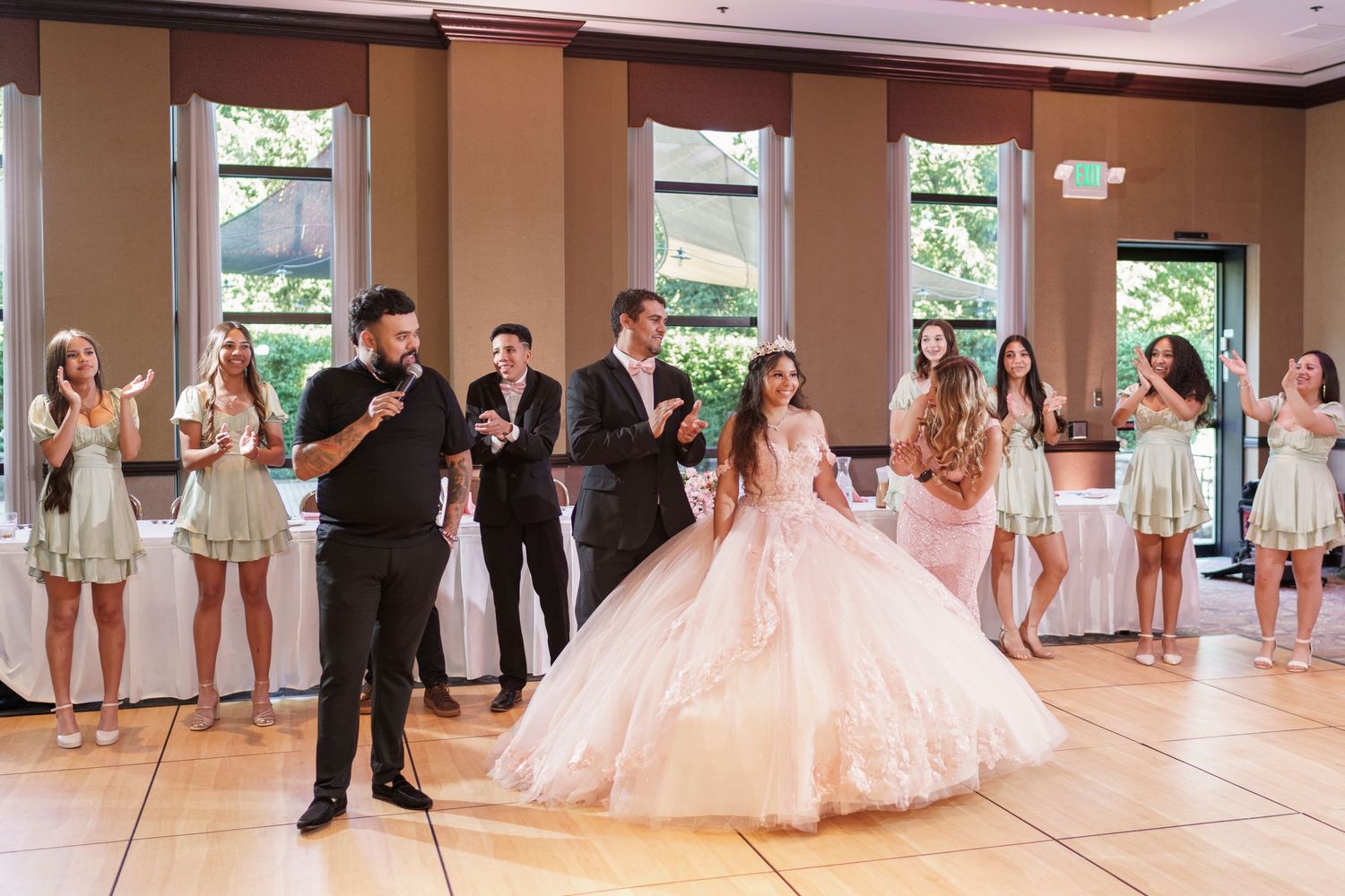 Panoramic view of a quinceanera with her court & family after entrances at The Center of Visual and Performing Arts in Munster, IN