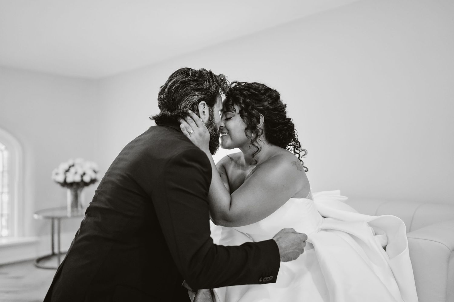 A romantic black and white candid moment of bride & groom captured at a wedding celebration at Kaleidoscope wedding venue in Pierceton, IN