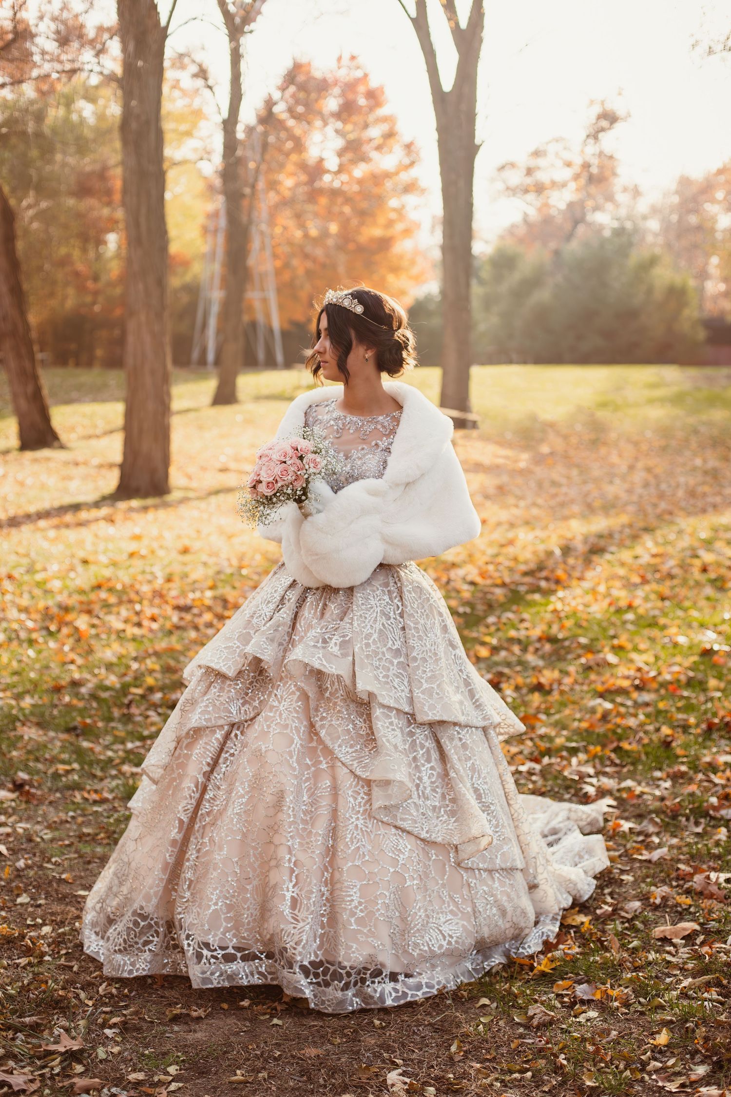 Fall wedding portrait featuring ballgown with tiered skirt and white fur wrap.