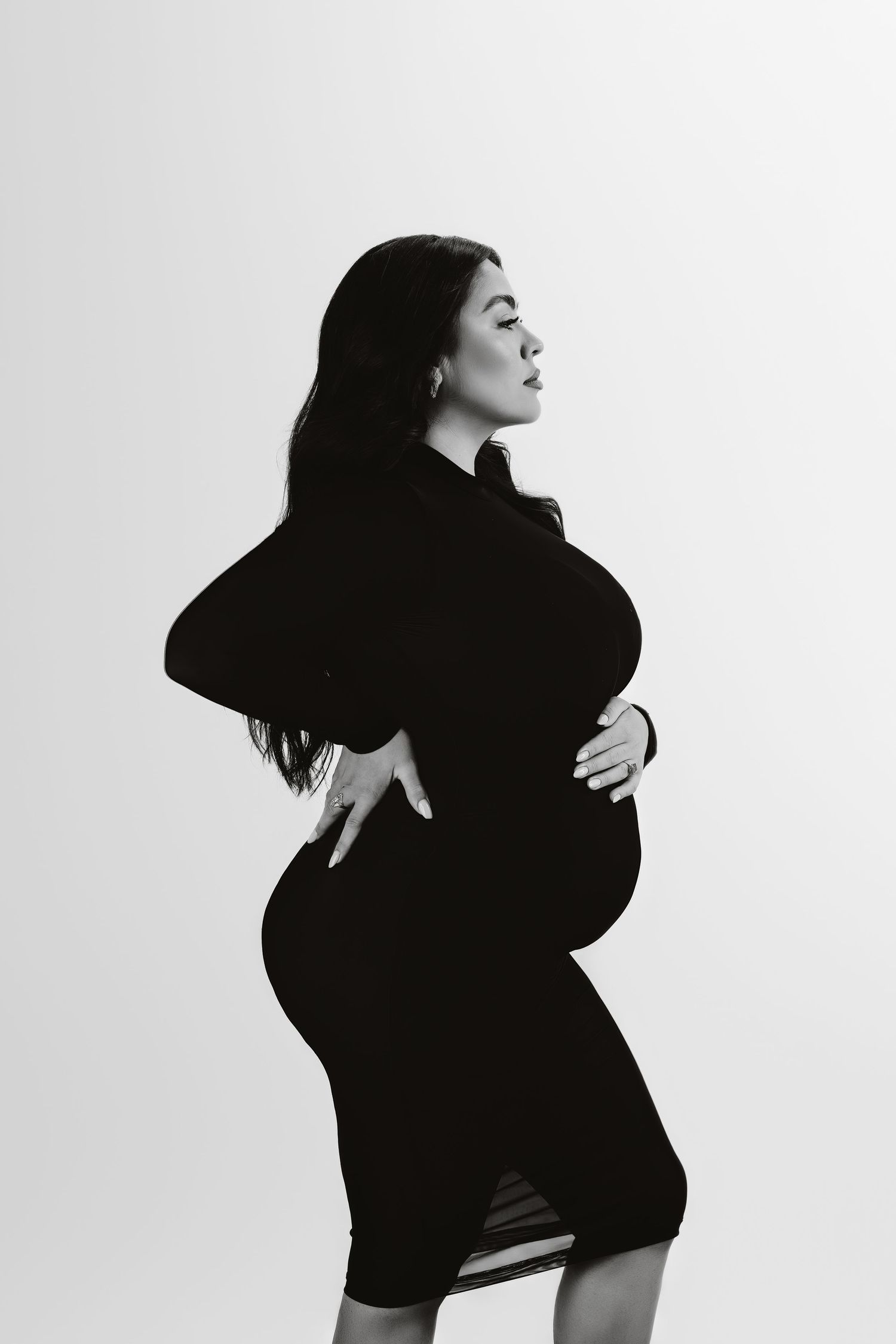 Black and white artistic photo series showing a figure in dramatic poses against a white background.