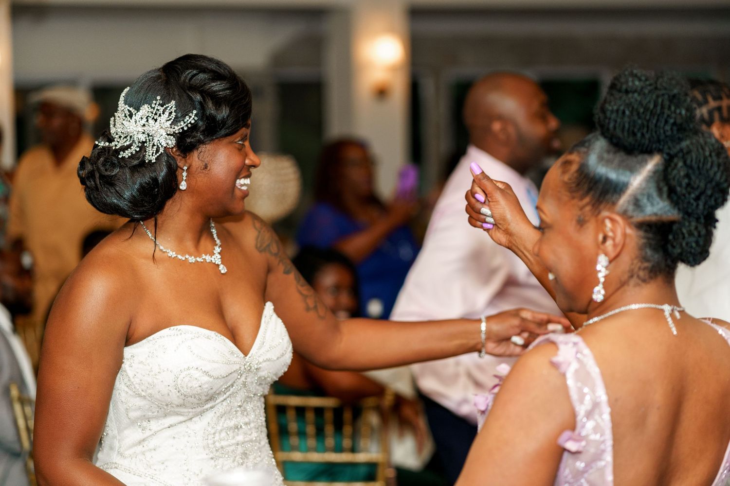 Wedding celebration features intimate moment during reception with elegant decor.
