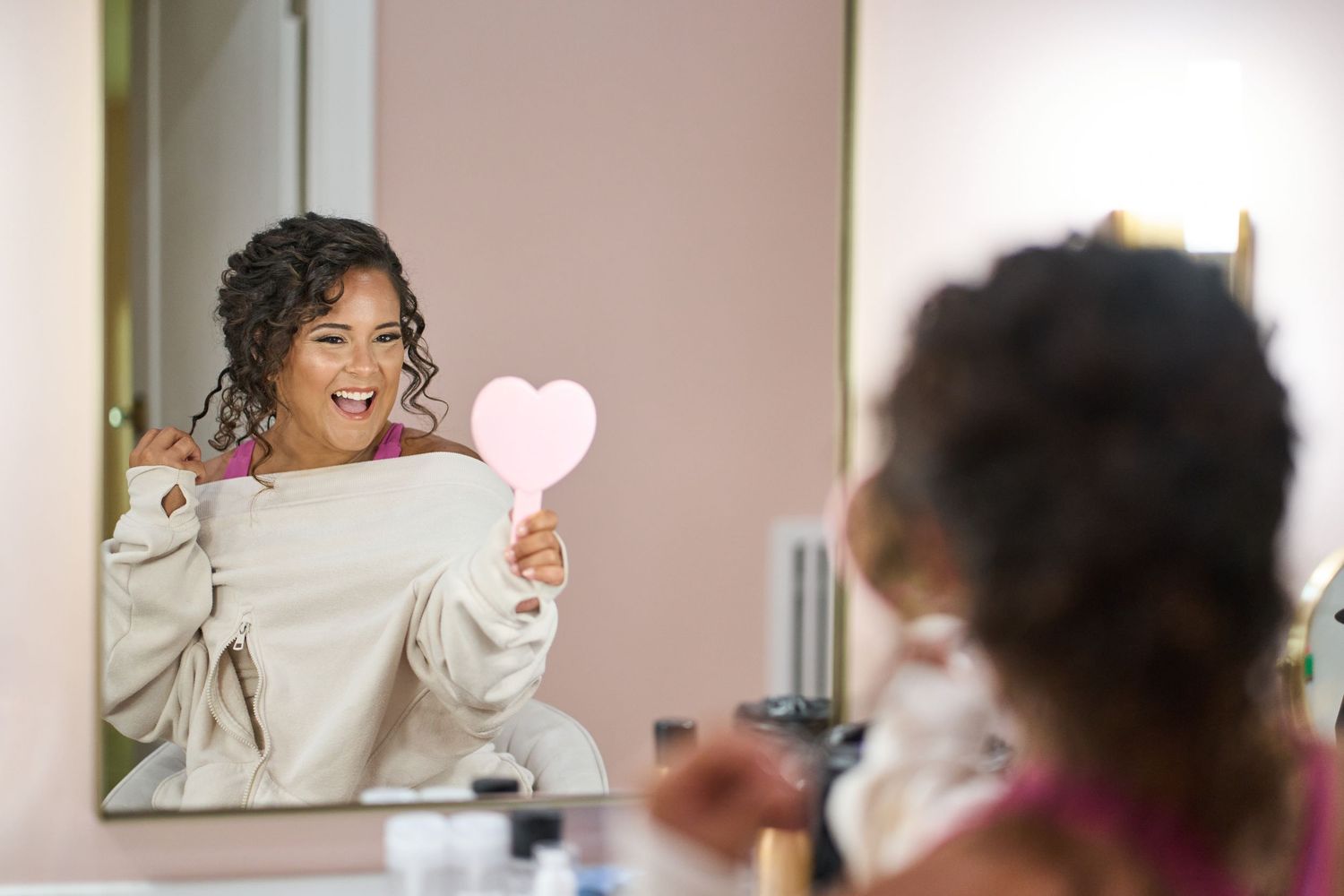 Candid moments of wedding party preparations with natural light streaming through windows.