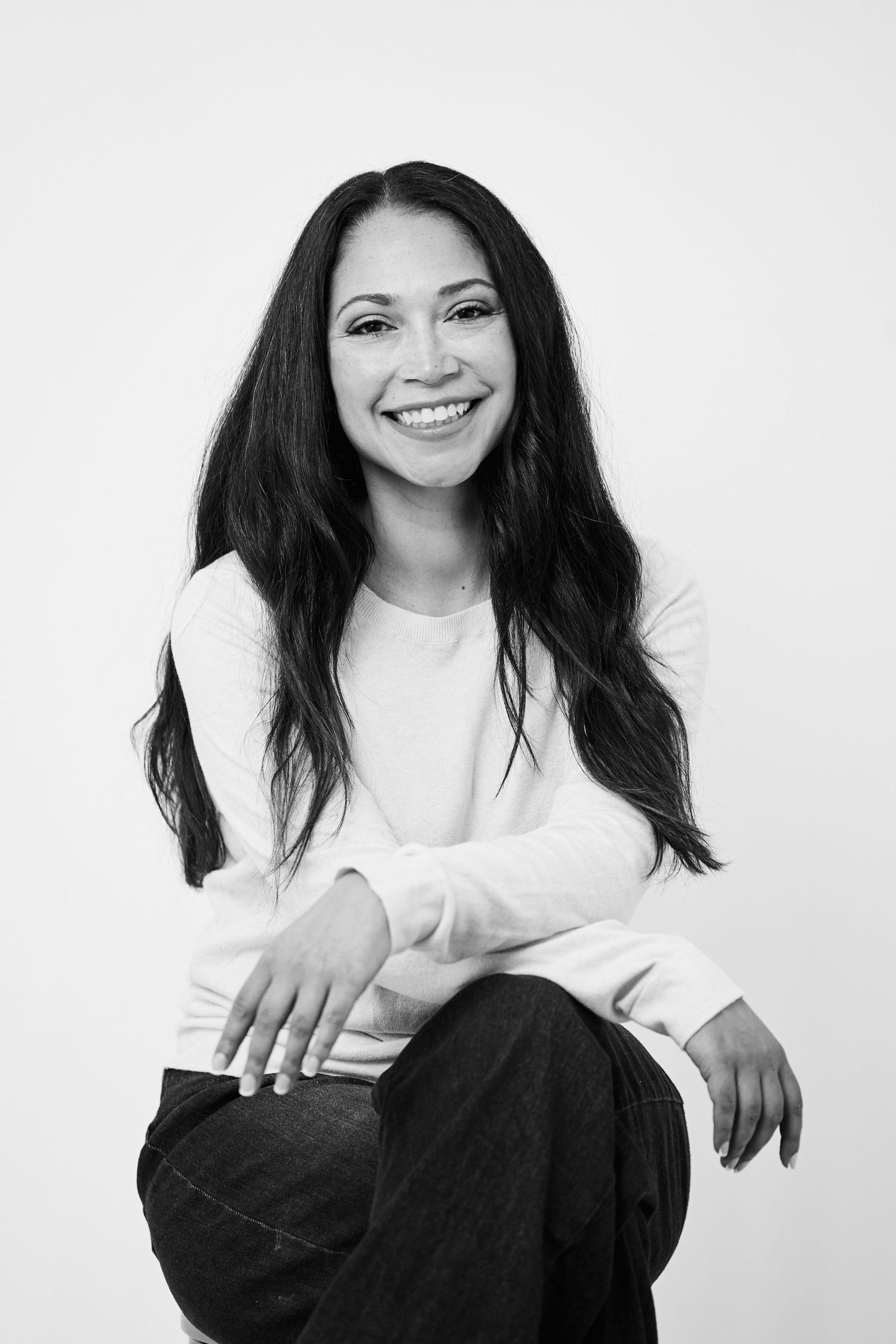 A black and white photo series showing a person in a white top and dark pants against a light background.