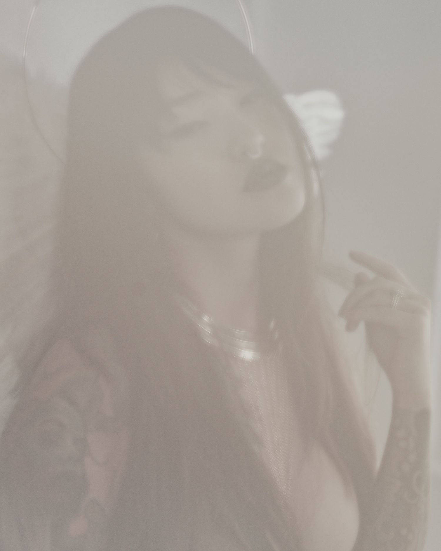 Dreamy overexposed portrait in soft focus with angelic aesthetic.