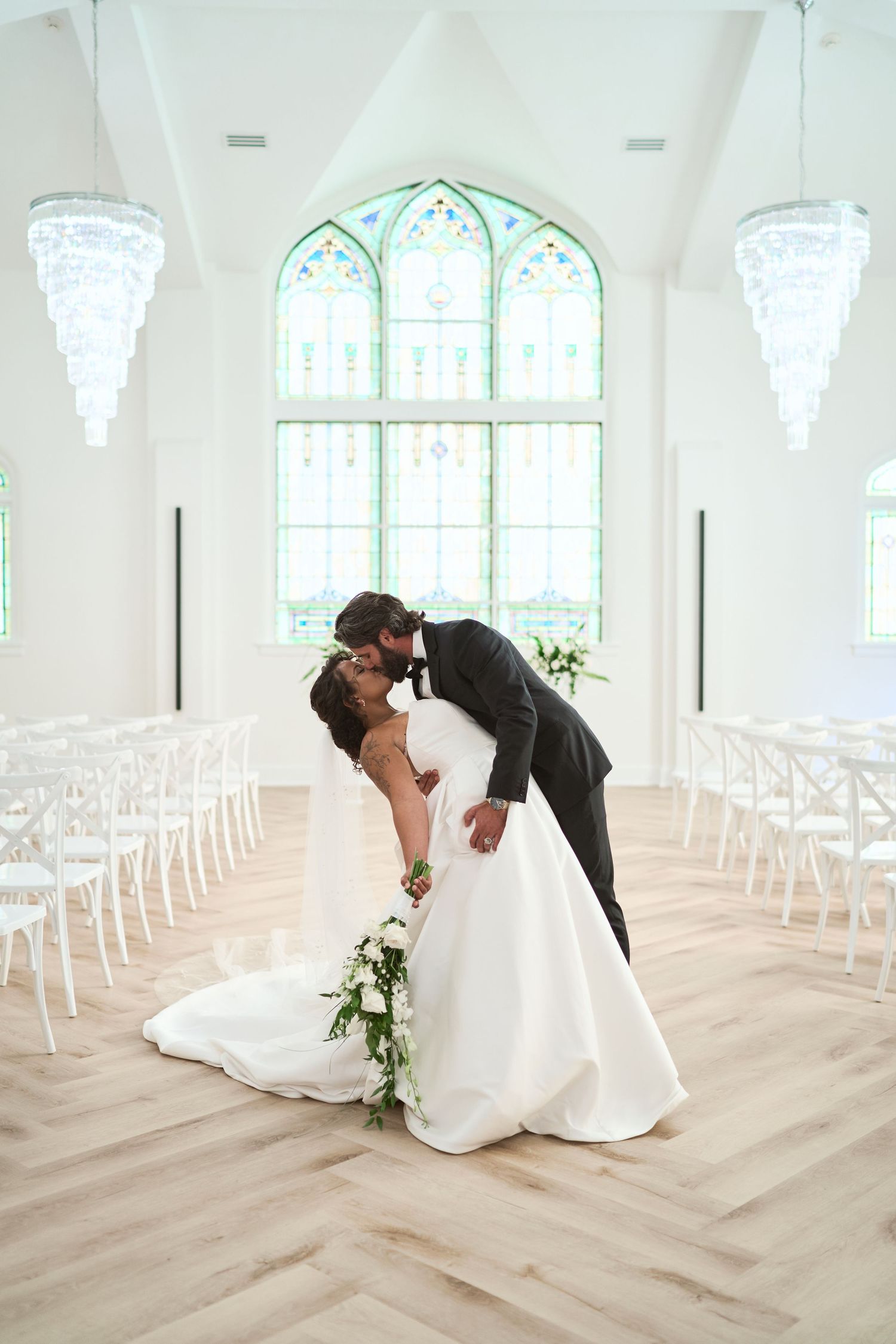 A beautiful wedding scene in a white chapel featuring romantic dips and poses across five sequential photographs.