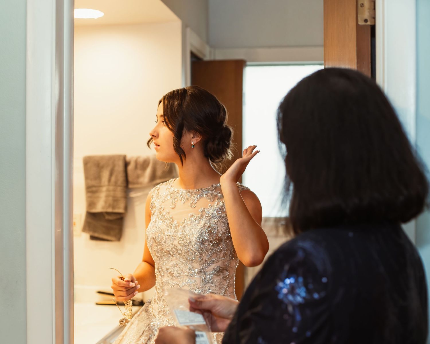 Getting ready scene of wedding preparations in a bright interior space.