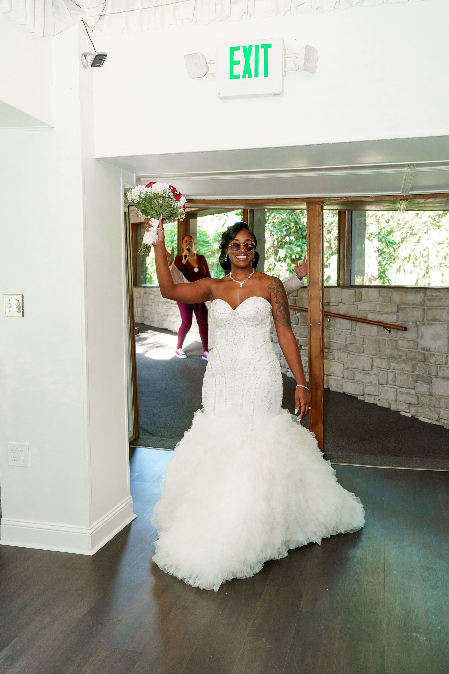 A bride in a stunning white mermaid wedding gown makes her grand entrance.