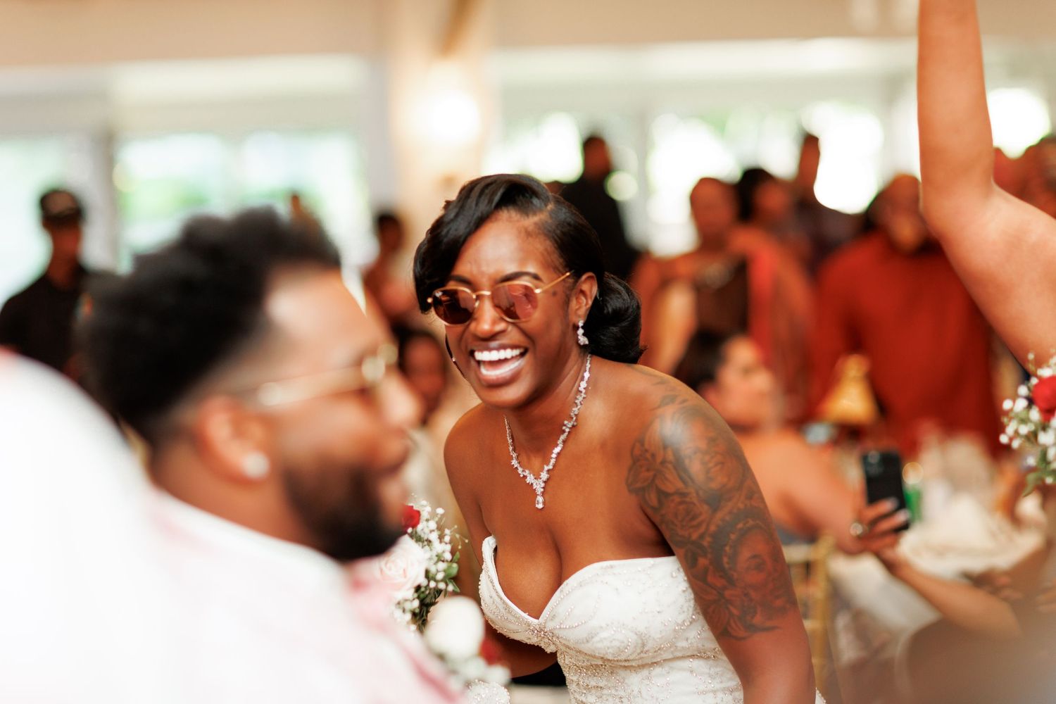 A joyous moment of celebration and laughter during a wedding reception.