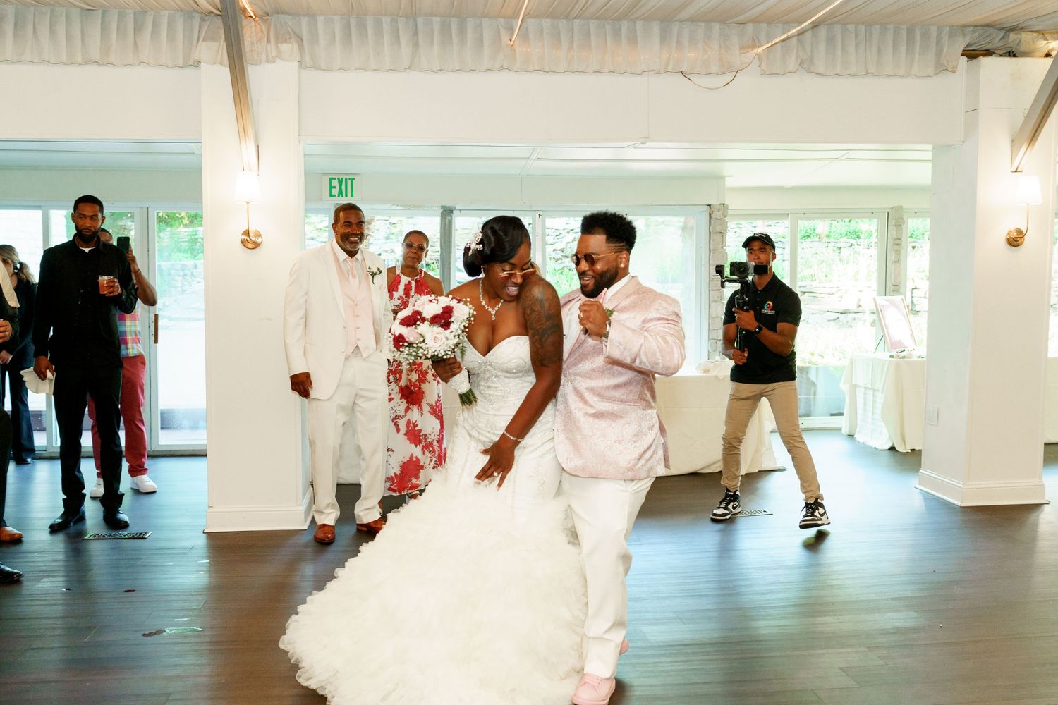 A spirited dance celebration during a modern wedding reception.