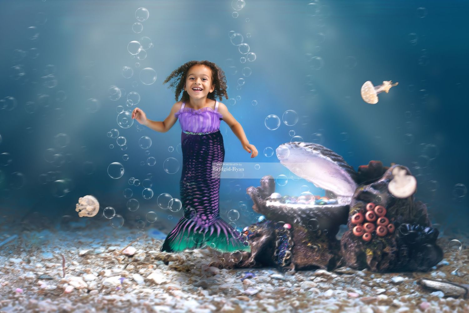 Magical underwater scene with bubbles and jellyfish featuring a mermaid swimming in a blue ocean setting.