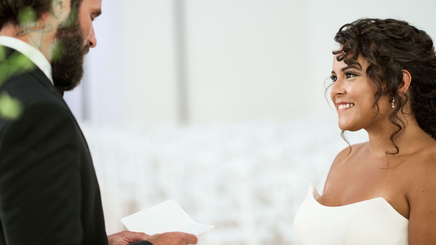 Emotional wedding moment captured in bright church setting.