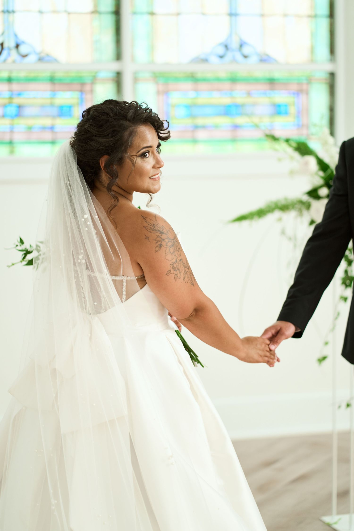 A sequence of color photos showing a bride in an elegant white wedding dress and veil in a bright indoor setting.