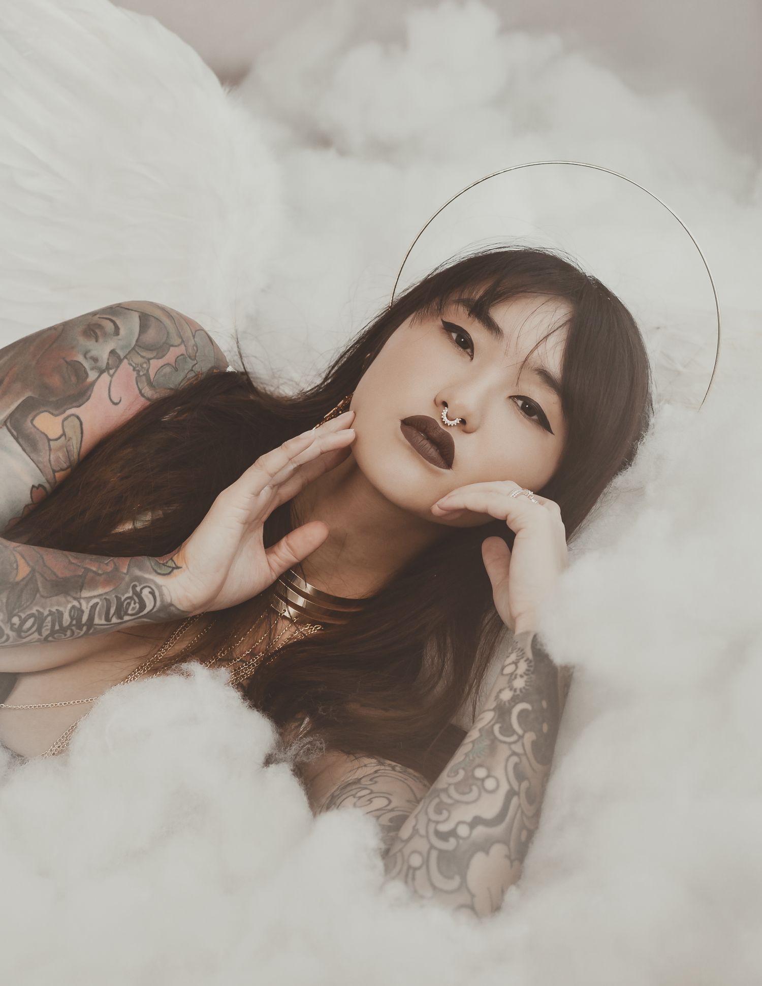 Dark gothic fantasy portrait with halo effect surrounded by white clouds and mist.