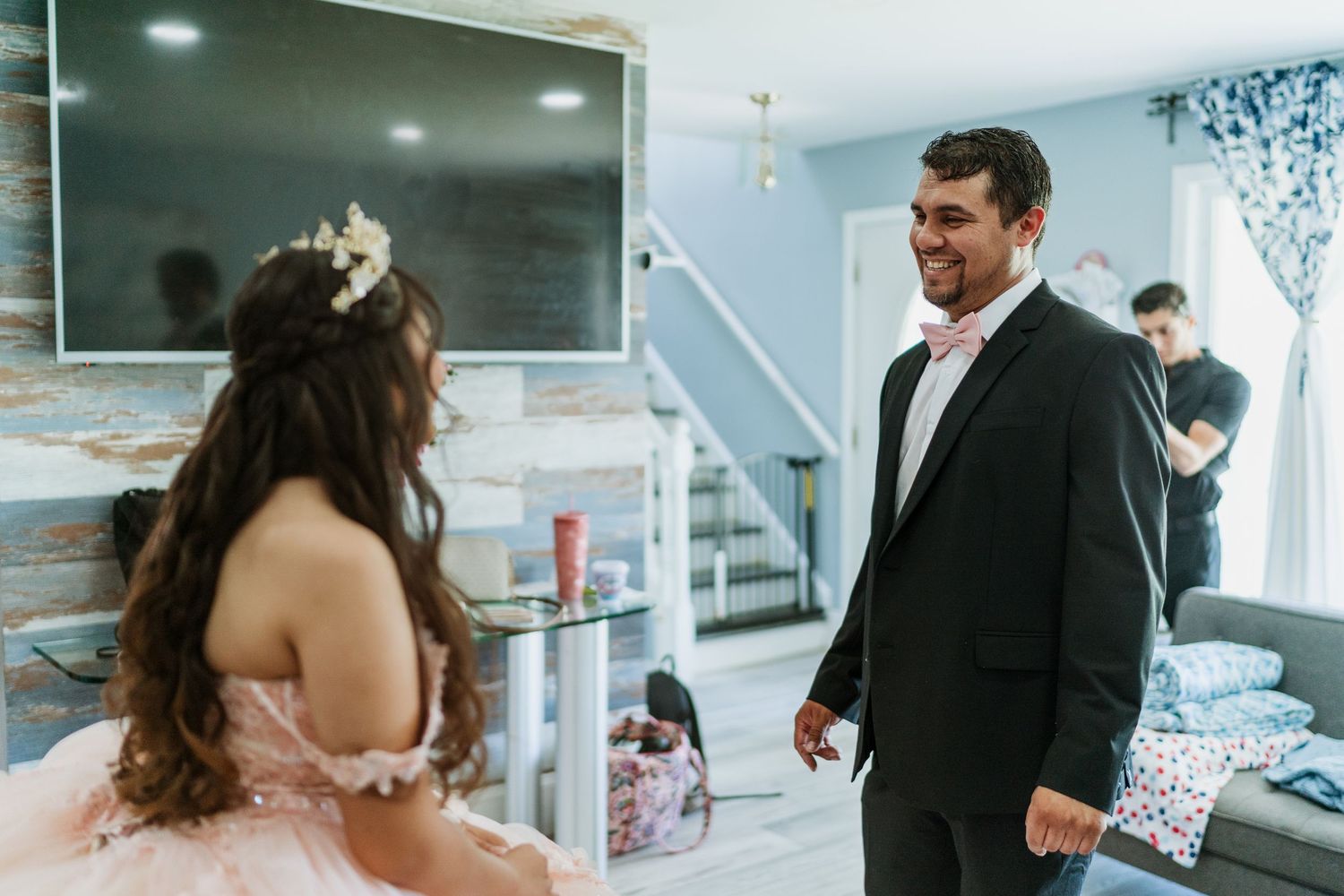 First look moment captured in an indoor setting with natural lighting.