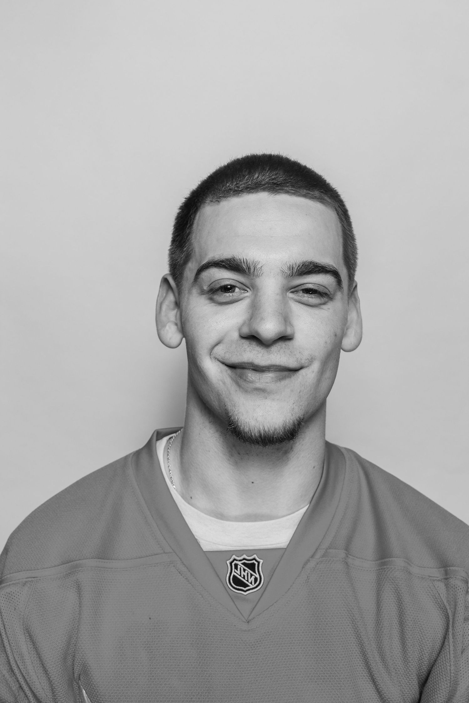 Black and white portrait sequence displaying changing facial expressions.