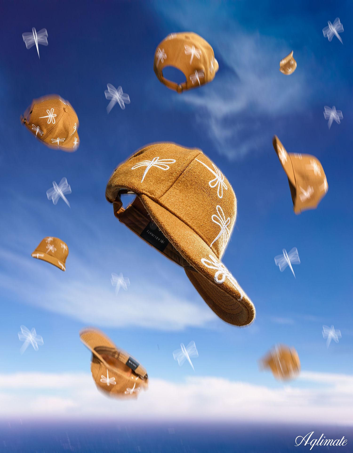 Brown baseball caps floating against blue sky background in artistic composition.