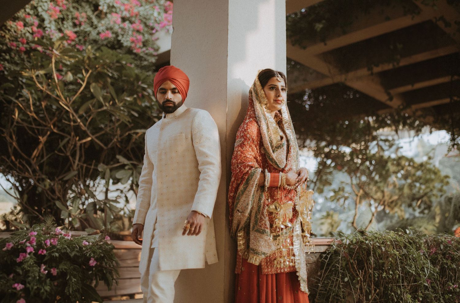 Traditional Indian wedding ceremony with colorful floral decorations and elegant attire.