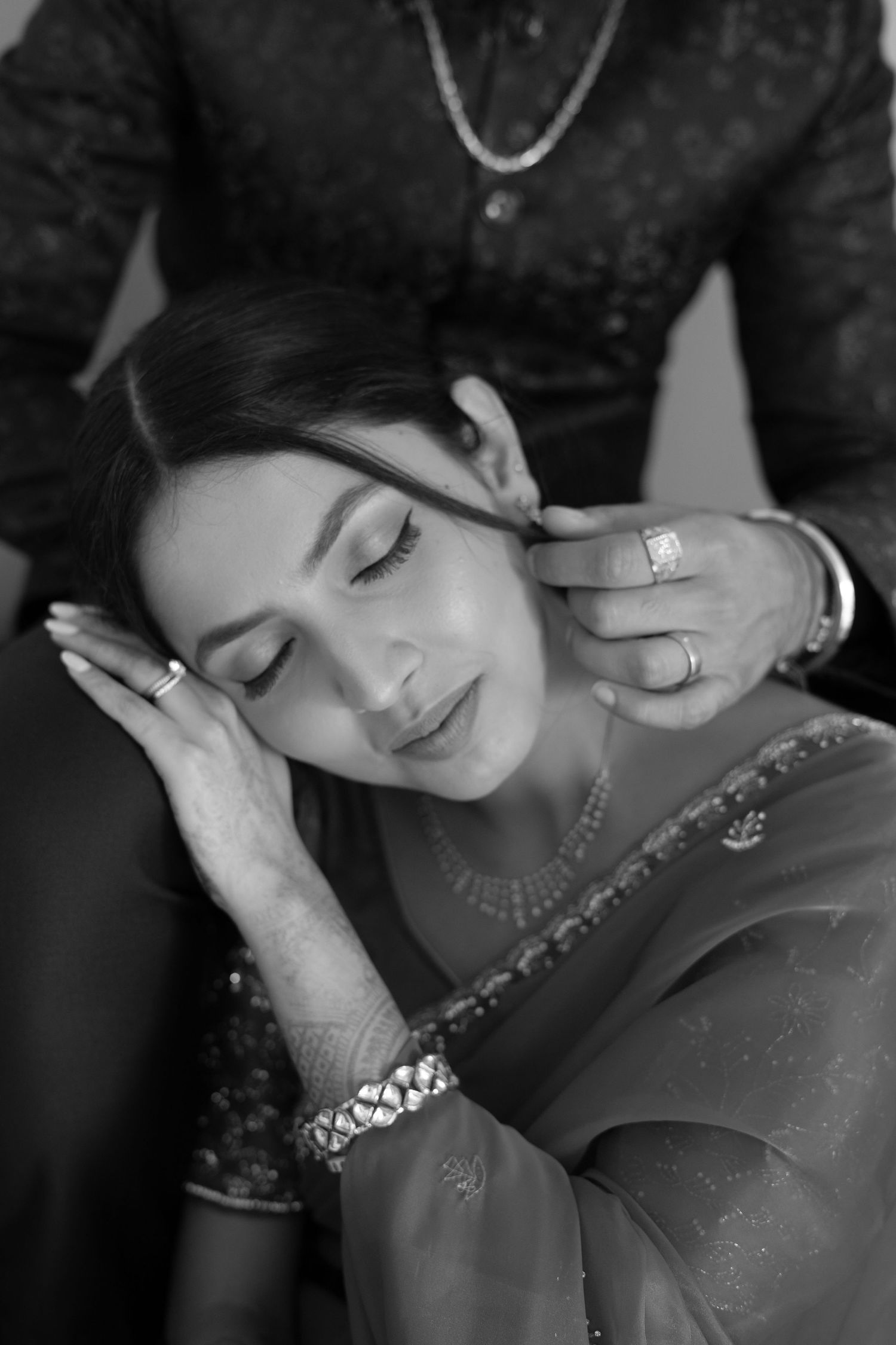 Black and white intimate portrait sequence showing tender moments between a couple.