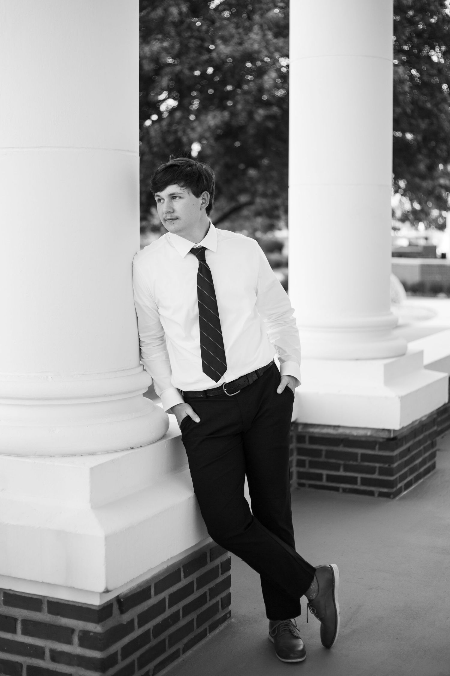 Portrait of a young man dressed for college graduation