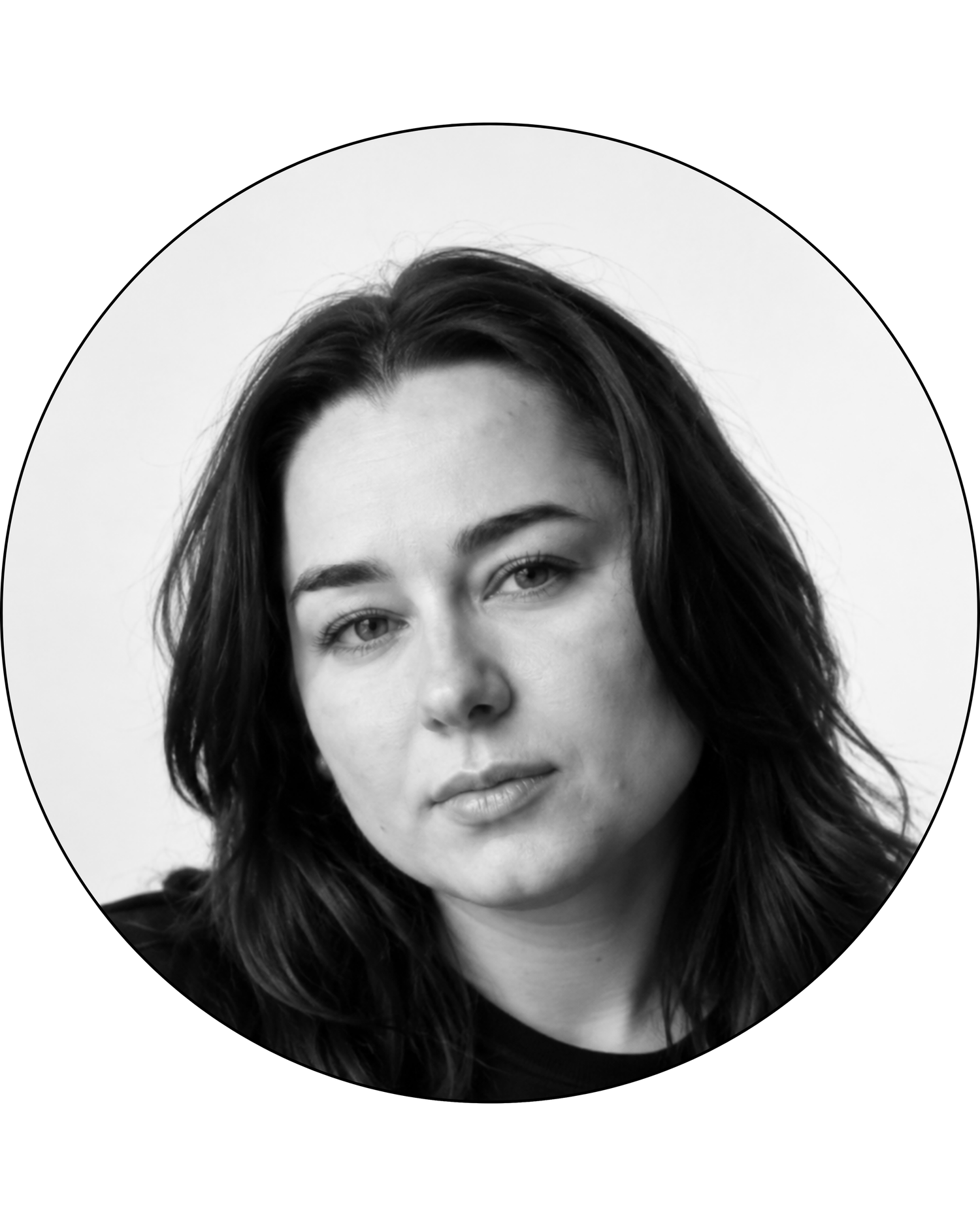 Black and white portrait of a dark-haired woman in a circular crop frame.