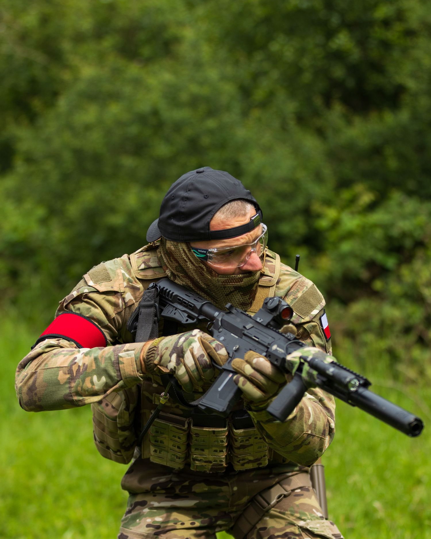 Soldier in multicam uniform and black beret aiming rifle during outdoor military training exercise. Photo Taken by AJCoatesPhotography