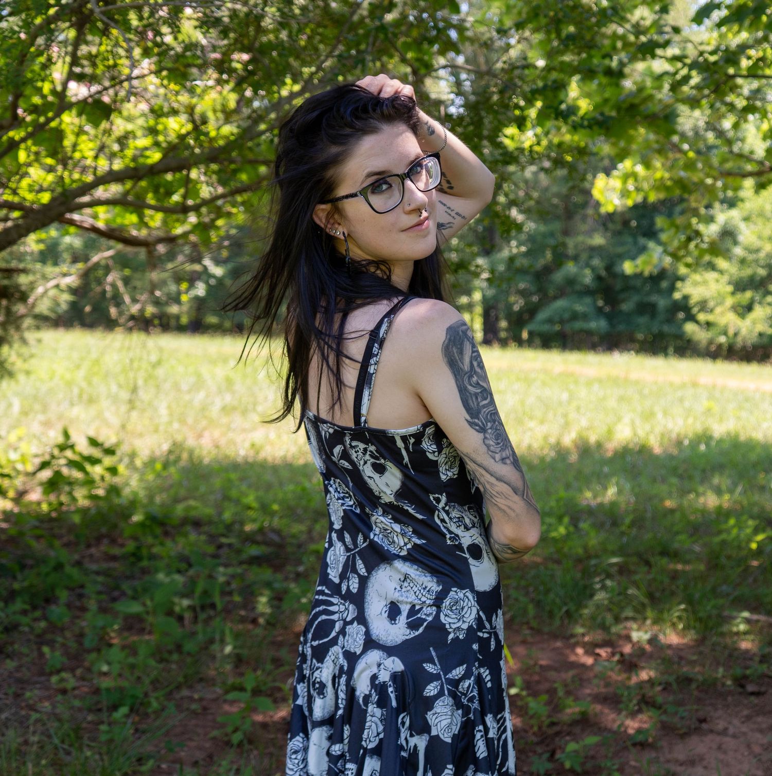Woman looking over her shoulder during an outdoor portrait session.