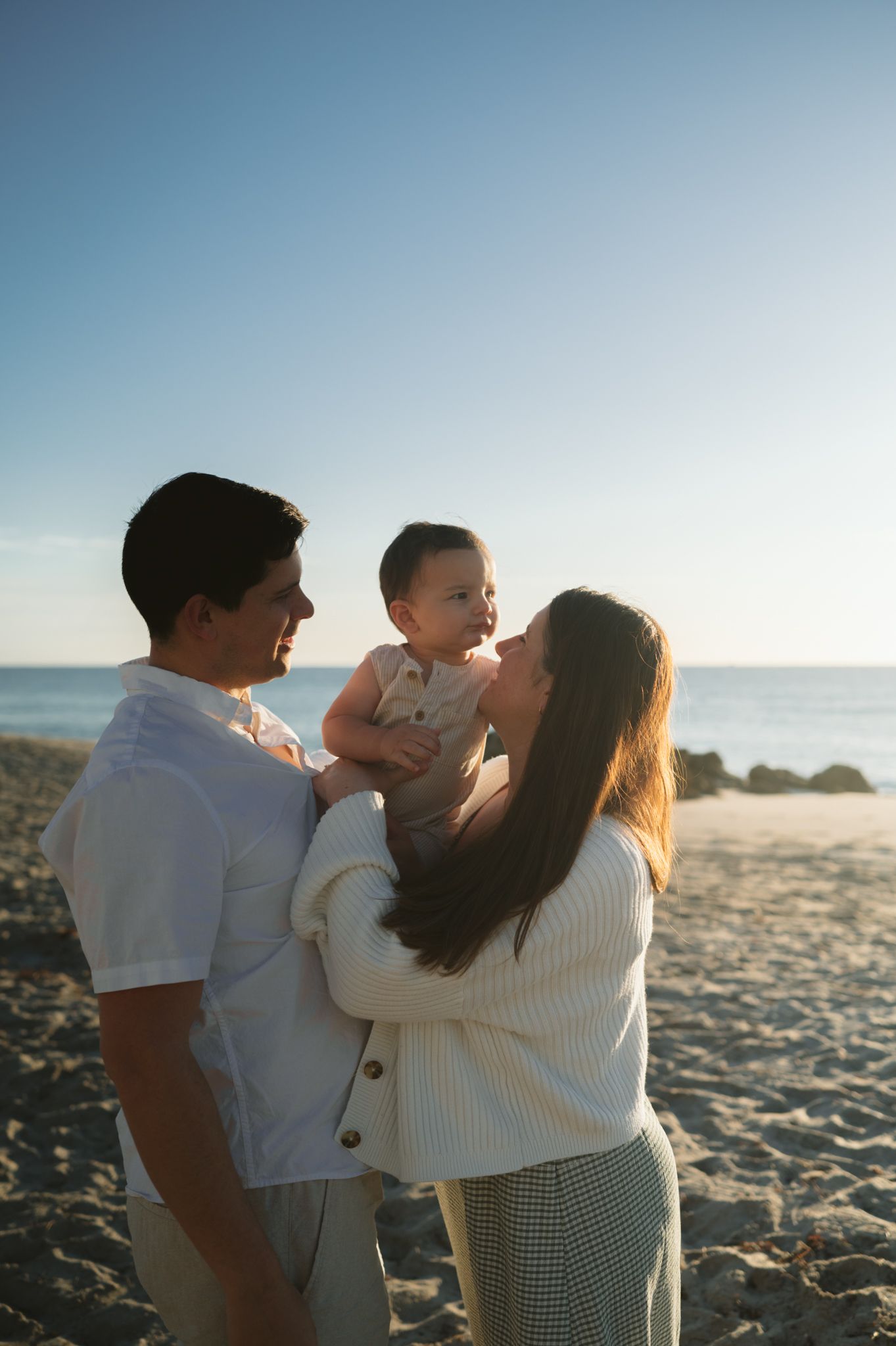 Coral Gables family photographer photographing parents and children outdoors
