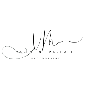 Valentine Manemeit Photography logo featuring elegant cursive initials VM with delicate flourishes on white background.