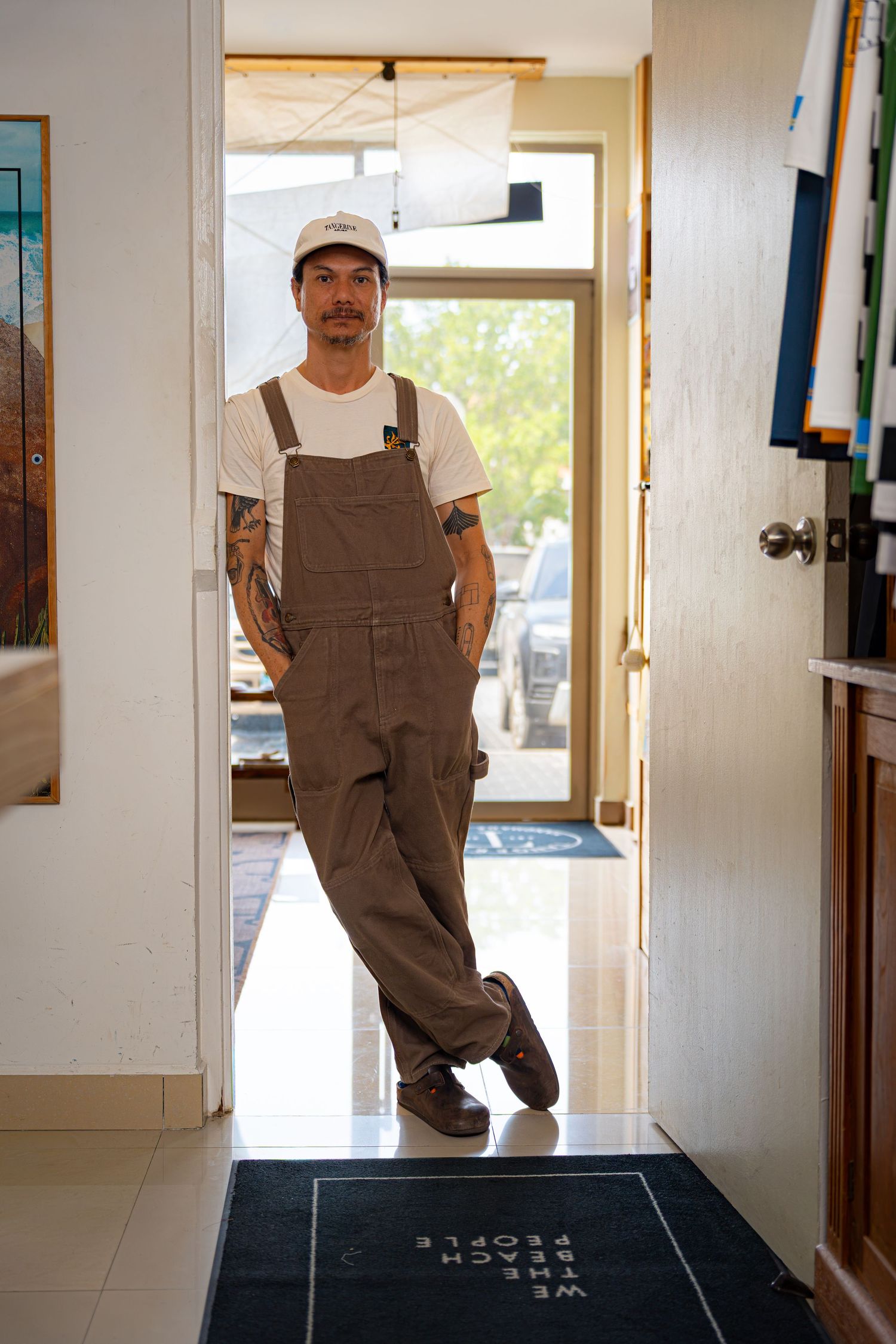 Aruba branding photographer Jonathan Geerman standing in a doorway during a personal branding session.