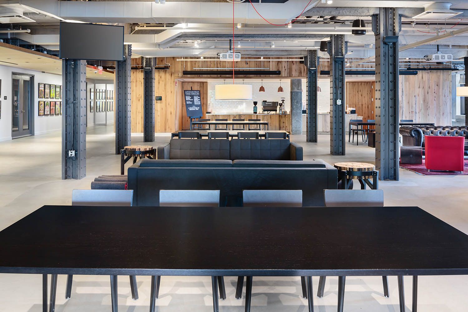 Converse Boston HQ interior architectural office space photography common space seating area near cafe location.