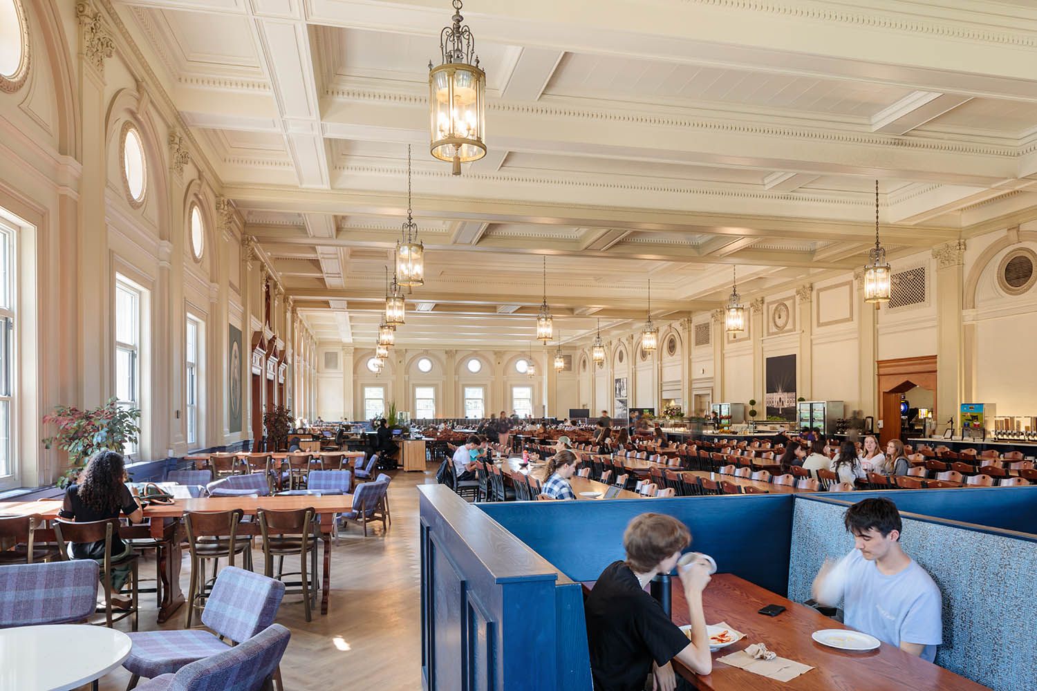 Architectural college photography of main dining room at Holy Cross in Worcester MA to show buffet selection and seating areas.