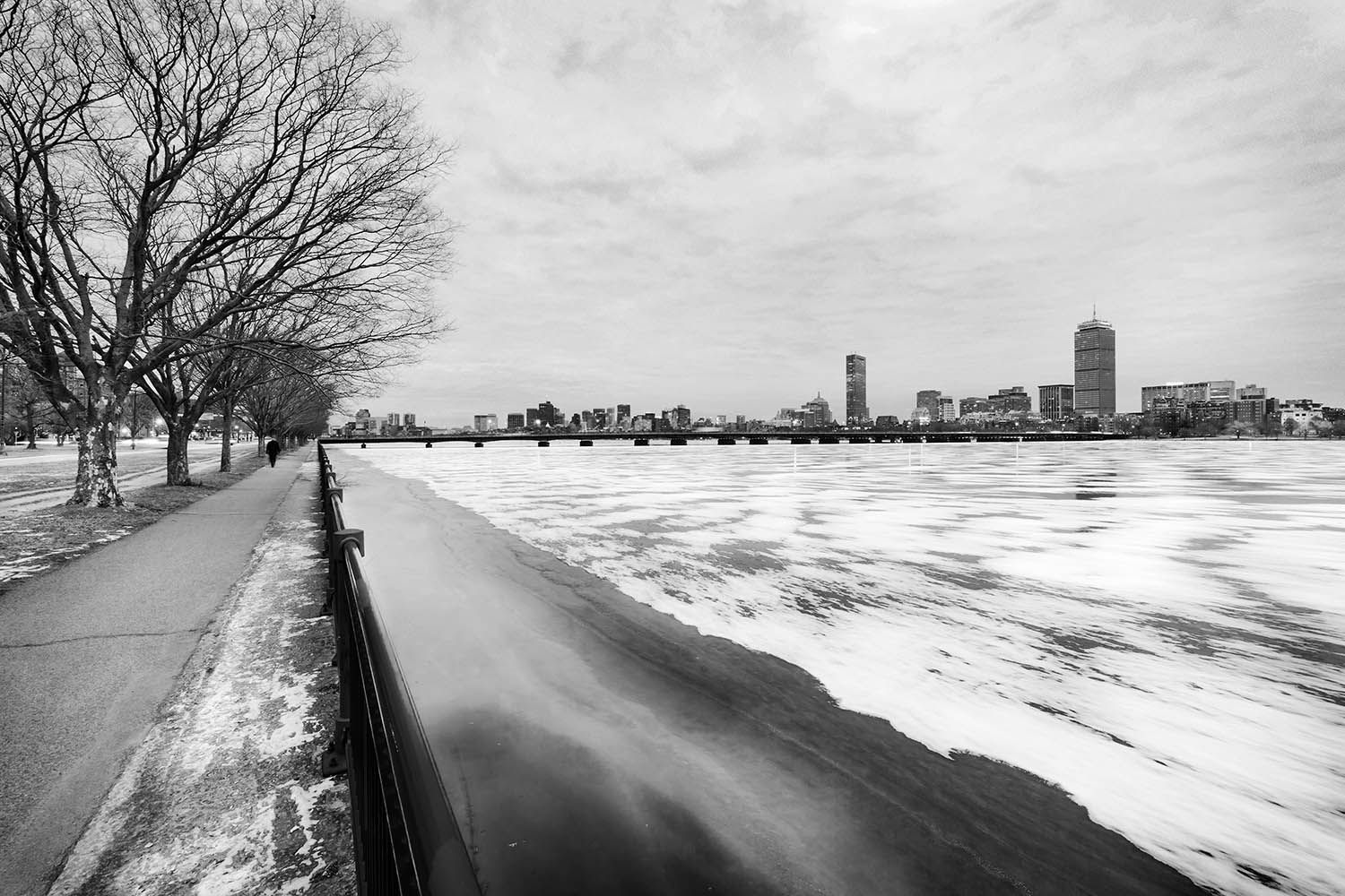 BLACK AND WHITE WINTER PHOTOGRAPHY LANDSCAPE IN BOSTON MASSACHUSETTS SHOWING THE CHARLES RIVER FROZEN