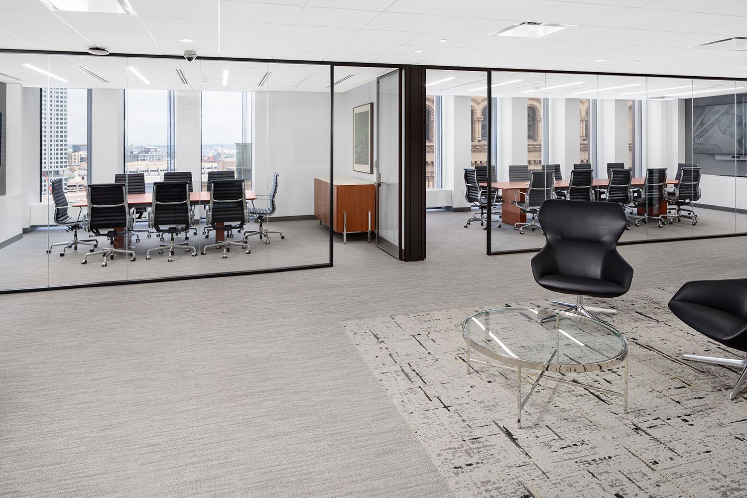 BOSTON AREA NEW OFFICE RENOVATION PROJECT SHOWING THE WAITING AREA AND LARGE BOARDROOM BEHIND
