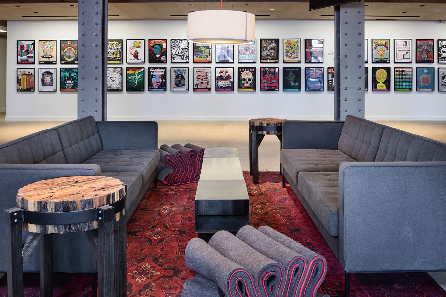 Converse Boston HQ interior office space photography ground floor seating area and artwork display.