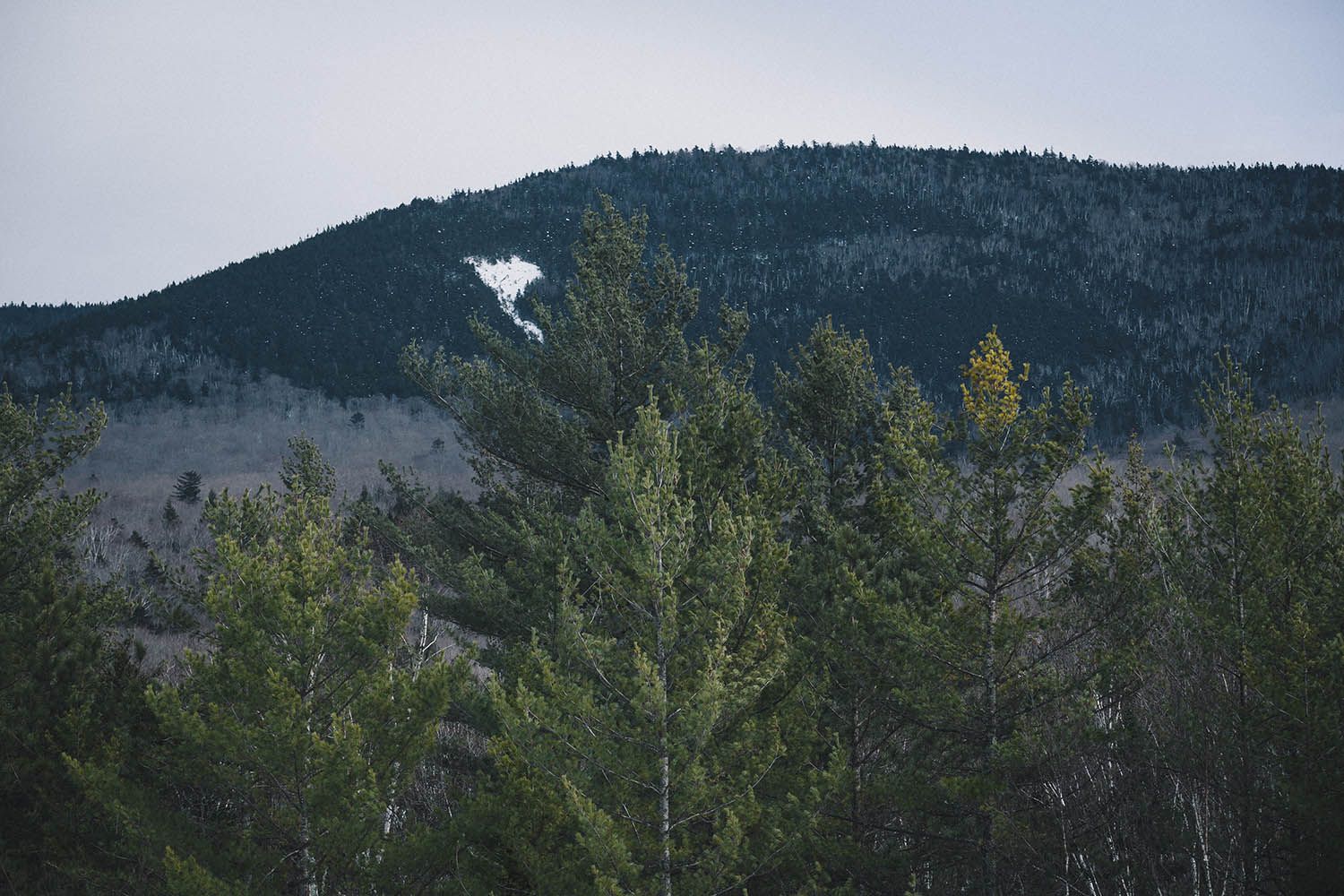 Color landscape photograph showing the White Mountains in New Hampshire winter by architecture and landscape photographer Roberto Farren