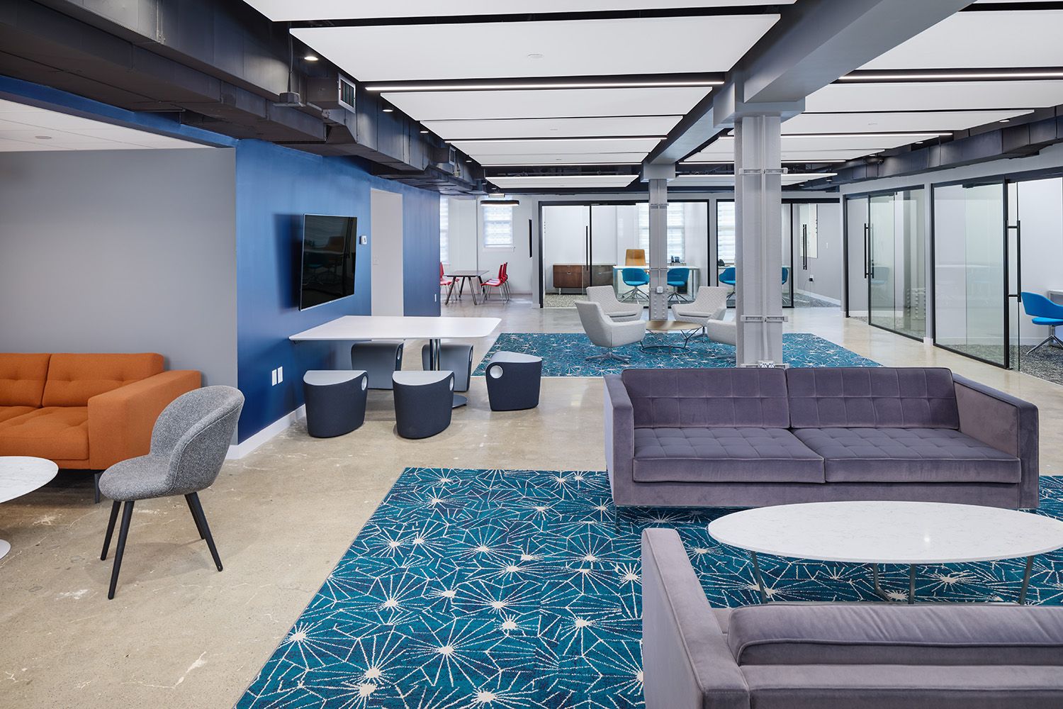 THE MAIN AREA IN A BOSTON PHARMACEUTICAL COMPANIES OFFICE TAKEN IN AN ARCHITECTURAL STYLE USING LIGHTING TO SHOWCASE DETAILS
