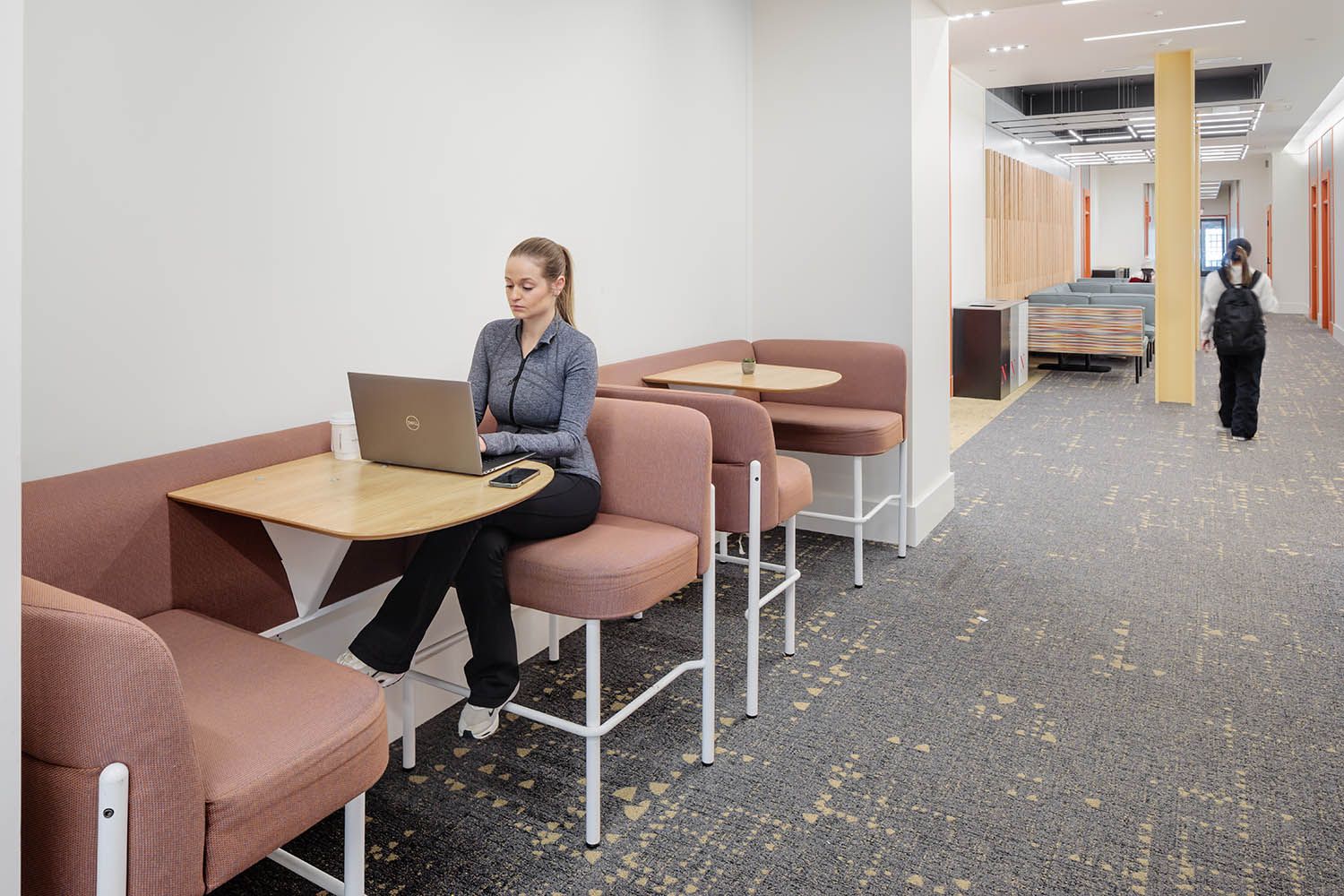 Boston College photography for local architects showing common area corridor on the ground floor with seating and elevator access.