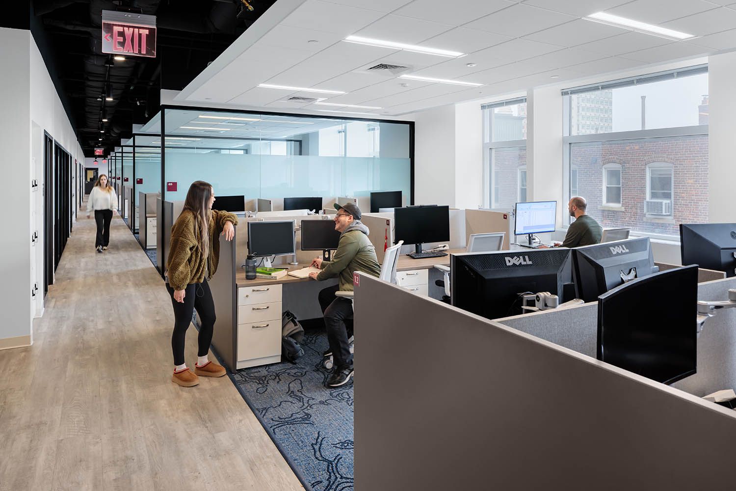 Boston office photography for Bergmeyer architects showing desk setup and side study rooms in New England college space with people