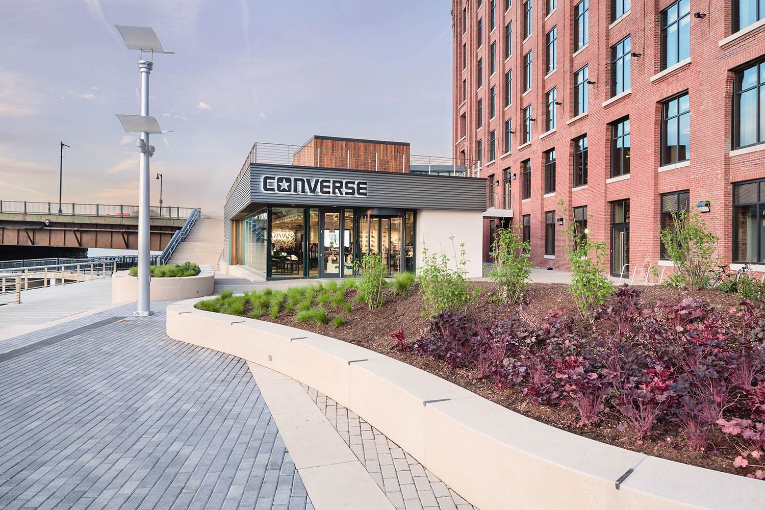 Converse Boston HQ exterior architectural office space photography showing retail store onsite and showing the landscaping around building