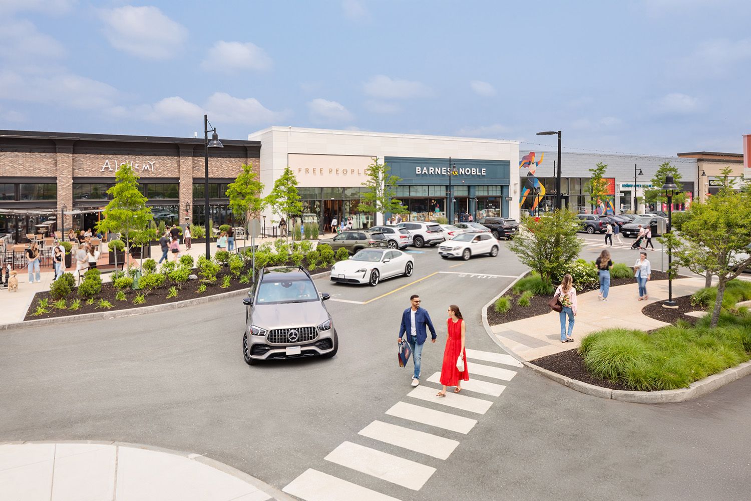 TWO PEOPLE CROSSING THE ROAD IN THIS RETAIL ARCHITECTURAL STYLED IMAGE NEAR BOSTON MA