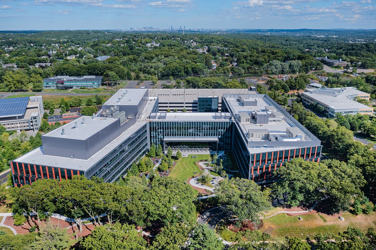 BOSTON ARCHITECTURE PHOTOGRAPHER IMAGE FROM DRONE OF BOSTON AREA OFFICE AND LIFE SCIENCES BUILDING AERIAL VIEW WITH BOSTON IN BACKGROUND