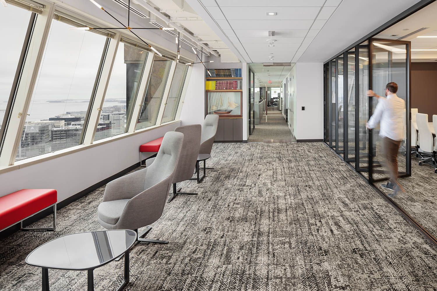New corporate office design and build out for architects Unispace Global in Boston, board room with retractable glass doors to open the spac