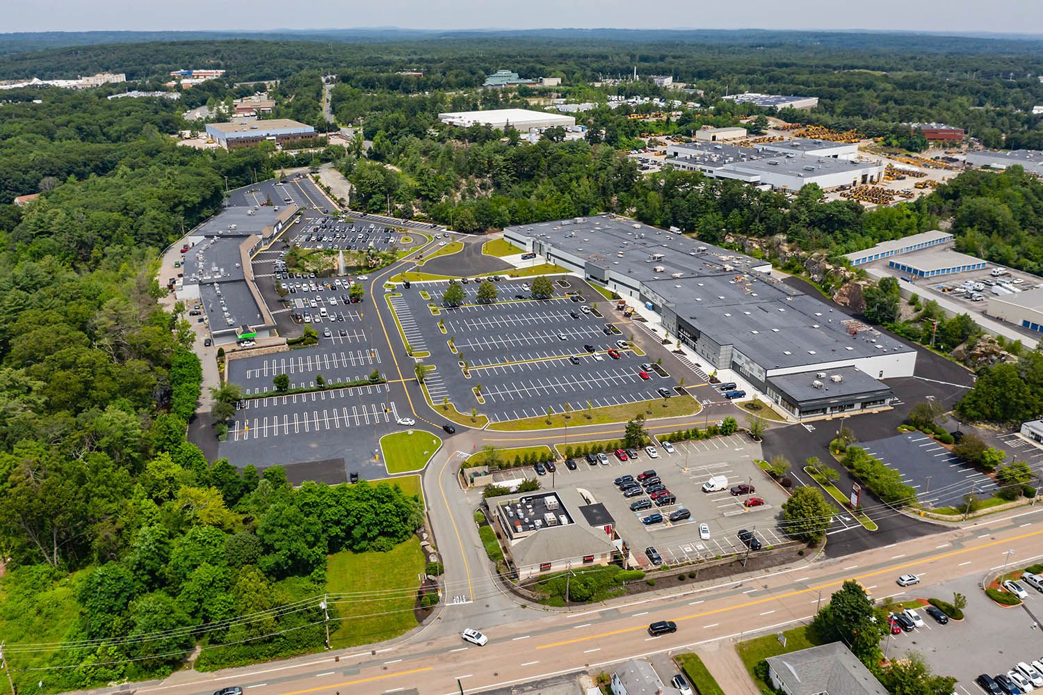 Architectural aerial photograph of mixed retail and office space use near Boston MA